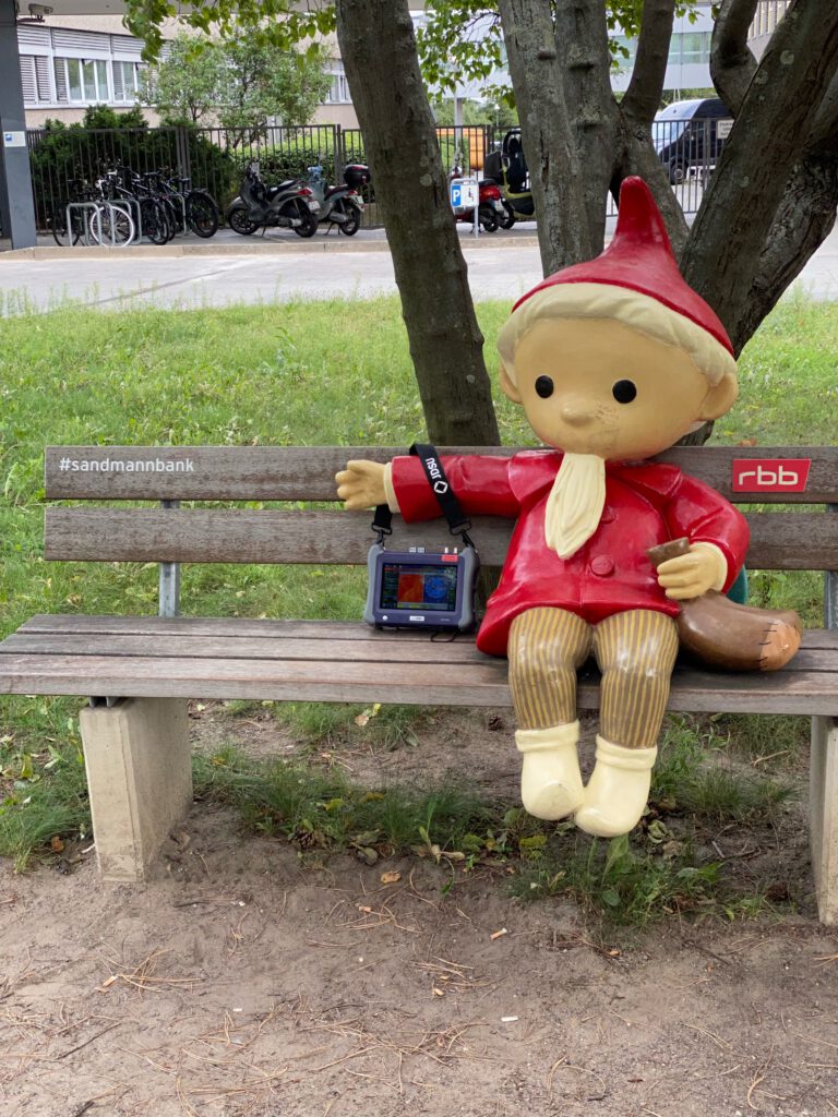 Simplexity team member on a bench on a broadcaster’s campus